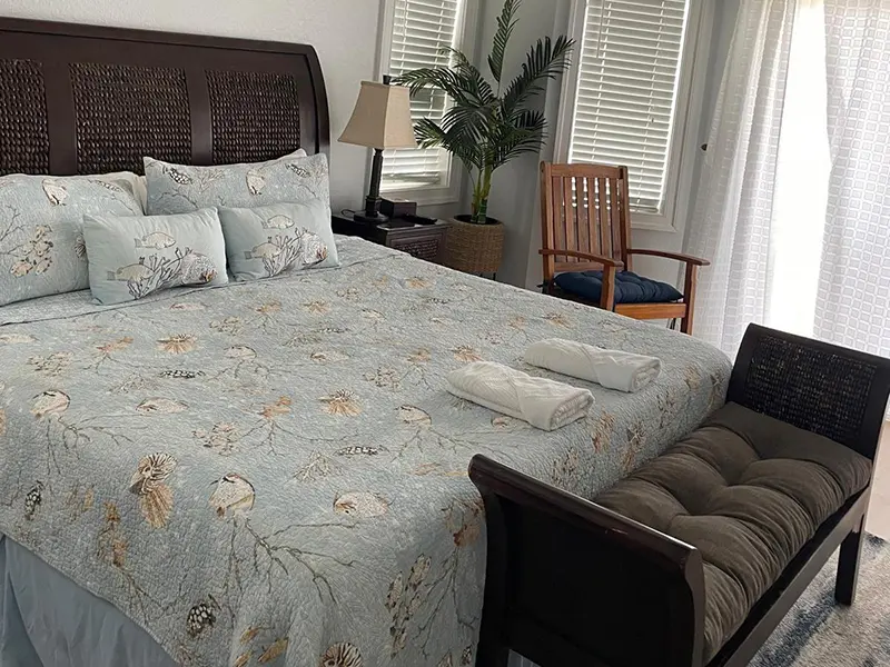 Professional cleaning a modern bathroom faucet.